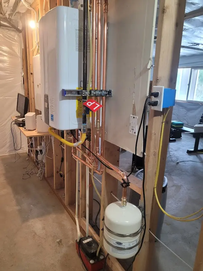 Licensed plumber repairing a kitchen sink in Walker